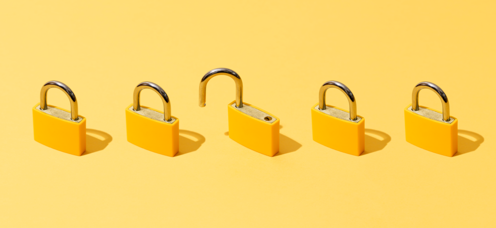Five yellow locks in a line. The middle lock is unlocked. This represents consent management and customer data privacy.
