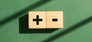 Two blocks stacked horizontally next to each other with a plus and a minus sign on them, representing decision making.